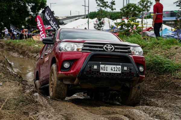 How can you improve your motorcycle's fuel efficiency through simple adjustments?